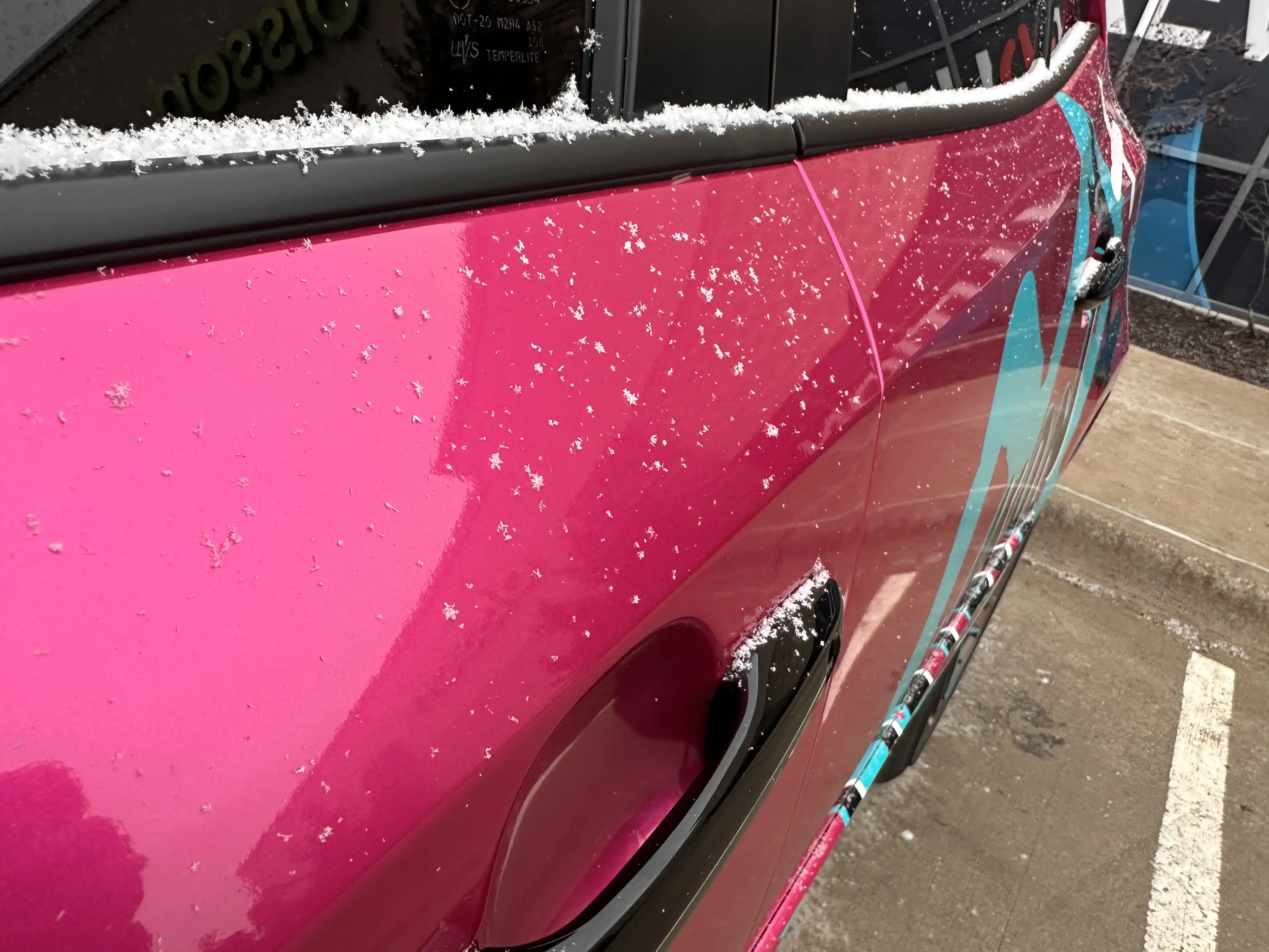 Pink wrapped Corolla showcasing winter vehicle wrap care by Revolution Wraps