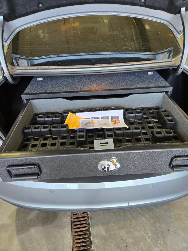 TruckVault cabinet drawer with Magpul DAKA GRID organizer holding secured equipment